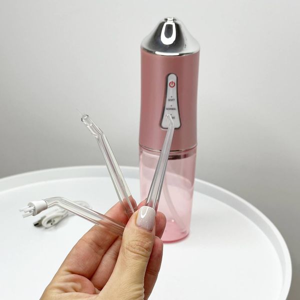 Ирригатор для зубов и полости рта Portable Oral Irrigator Розовый 100303 фото